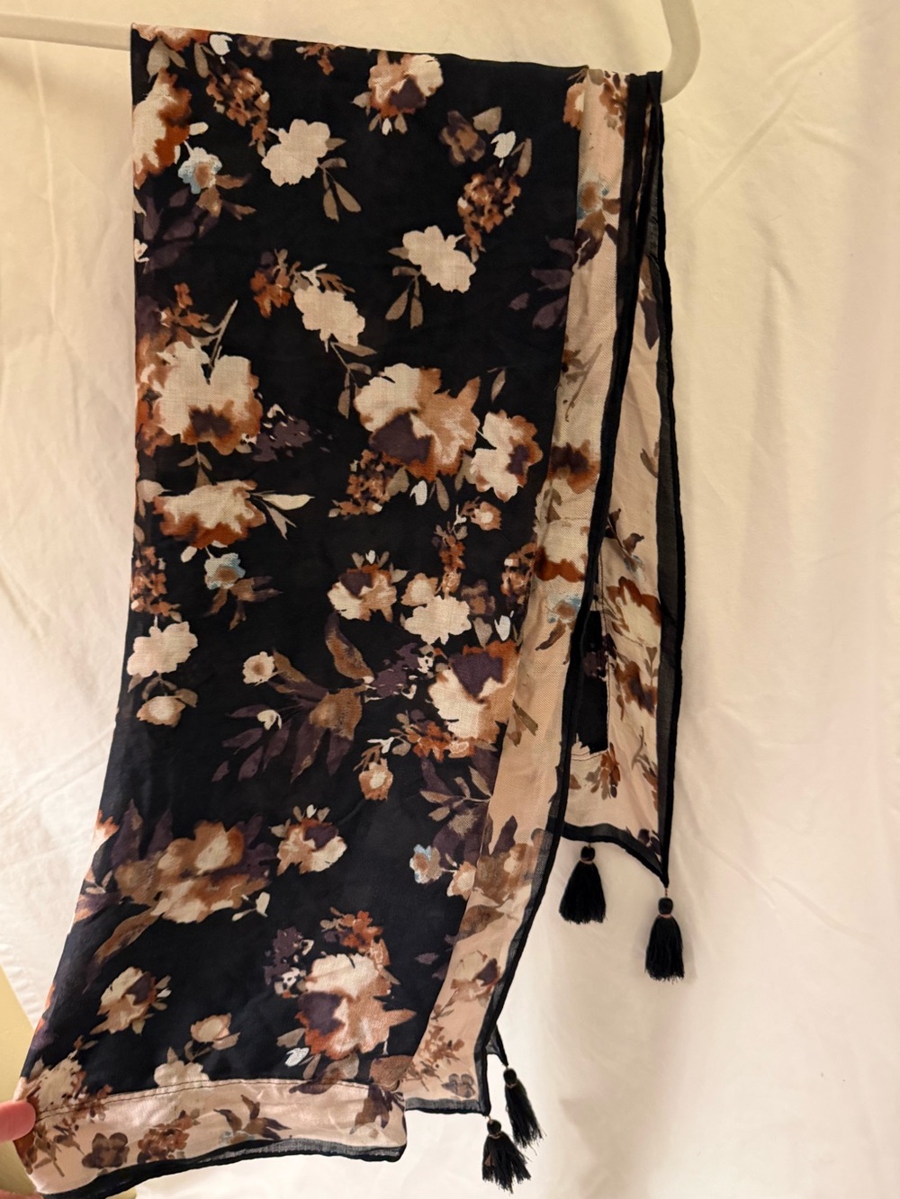 Pretty black and beige scarf with florals and tassel at ends. Easy